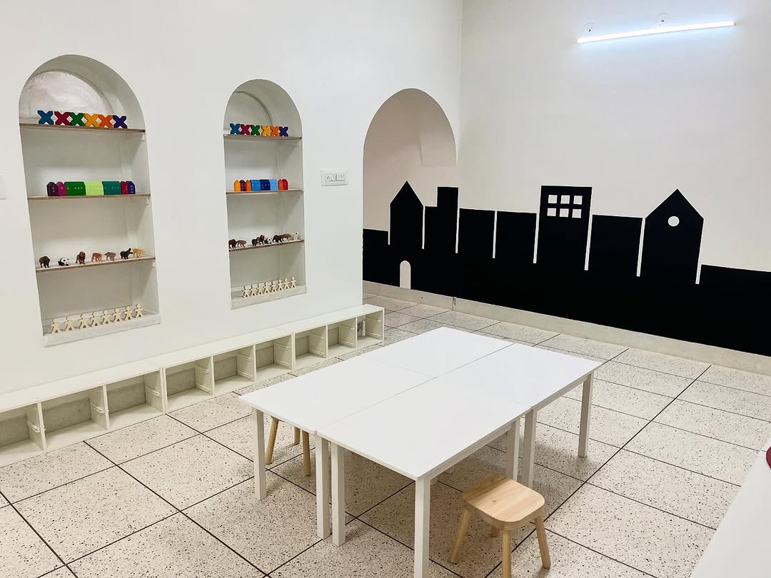The bright Montessori classroom at the Ratanada branch, with low shelves the children reach themselves